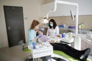For many dentists, practice ownership represents the ultimate professional milestone. However, one major decision stands in the way: buying a dental practice vs. starting one from scratch. Both options offer significant opportunities, but they also come with different risks, costs, and rewards. Some dentists prefer purchasing an established clinic with existing patients and predictable cash flow. Others dream of creating a modern practice tailored entirely to their vision. The right choice depends on your financial situation, career goals, risk tolerance, and desired lifestyle. This guide explores every major factor involved in buying a dental practice vs. starting one from scratch, helping you make an informed and confident decision. Understanding the Two Paths to Practice Ownership What It Means to Buy a Dental Practice When you purchase an existing practice, you acquire an operational business that typically includes: Existing patients Equipment and technology Office furnishings Established staff Brand recognition Historical financial records Instead of building everything from the ground up, you step into a functioning business environment. This can significantly shorten the time needed to generate income. What It Means to Start a Practice From Scratch Starting a practice from scratch means creating a new business from the ground up. This process often involves: Choosing a location Designing office space Purchasing equipment Hiring employees Developing marketing strategies Building a patient base Although this path requires more effort initially, it offers complete freedom and control over every aspect of the business. Initial Investment Comparison One of the most important factors in buying a dental practice vs. starting one from scratch is cost. Costs of Buying an Existing Practice A purchased practice often requires a substantial upfront investment. Expenses may include: Expense Category Typical Cost Impact Practice purchase price High Legal fees Moderate Due diligence Moderate Financing costs Moderate Transition expenses Moderate However, many acquired practices already produce revenue, helping offset the investment sooner. Costs of Building a New Practice A startup practice typically requires spending on: Leasehold improvements Construction Equipment purchases Technology systems Branding Marketing campaigns Initial staffing While startup costs can sometimes be lower than acquisition prices, new practices usually operate at a loss during the early months. As a result, dentists should evaluate both startup expenses and future cash flow projections before making a decision. Revenue and Cash Flow Considerations Immediate Income Advantages One of the strongest arguments for buying an existing practice is immediate cash flow. Patients are already scheduled. Insurance relationships are already established. Revenue often begins on day one. This creates several advantages: Easier loan repayment Reduced financial stress Faster profitability More predictable forecasting Many lenders view established practices as lower-risk investments because financial performance can be verified through historical records. Growth Timeline for New Practices Starting from scratch requires patience. New practices often spend months building awareness and attracting patients. Revenue growth may be gradual, especially in competitive markets. Common growth stages include: Brand development Patient acquisition Community engagement Referral generation Long-term retention Although growth may be slower initially, successful startup practices can eventually achieve outstanding profitability. Patient Base and Market Presence Benefits of Existing Patients An existing patient base represents one of the most valuable assets in a practice acquisition. Benefits include: Immediate appointment schedules Recurring treatment plans Established trust Predictable revenue streams Strong referral networks Patient retention is a key factor in acquisition success. The smoother the transition, the more likely patients will remain loyal. Building a Brand From Zero Startup owners begin with a blank slate. While challenging, this creates opportunities to: Develop a unique identity Target ideal patient demographics Create modern marketing campaigns Build a reputation intentionally Many dentists enjoy the entrepreneurial challenge of growing a brand from the ground up. For marketing insights, dentists can explore resources from the American Dental Association at https://www.ada.org. Operational Challenges Managing Existing Systems Acquired practices often come with established procedures. Advantages include: Existing workflows Trained employees Operational consistency However, inherited systems may also present challenges such as: Outdated processes Resistance to change Legacy technology Successful buyers evaluate operational efficiency before completing a purchase. Creating New Systems Startup owners must create every process independently. This includes: Scheduling protocols Billing systems Insurance workflows Staff training procedures Compliance standards Although time-consuming, building systems from scratch allows complete customization. Financing and Lending Opportunities Financing plays a major role in buying a dental practice vs. starting one from scratch. Lenders often assess: Credit history Professional experience Business plans Cash reserves Market conditions Existing practices frequently receive favorable lending consideration because they have proven revenue histories. Startup practices may require stronger business plans and more detailed financial projections. Before applying for financing, dentists should prepare: Personal financial statements Production history Tax records Growth projections Market analyses A well-prepared financing package improves approval chances significantly. Technology and Equipment Factors Technology influences productivity, patient satisfaction, and long-term profitability. When buying an existing practice, equipment quality varies widely. Questions to ask include: How old is the equipment? Are upgrades required? Are maintenance records available? Does technology support future growth? Some acquired practices contain cutting-edge technology. Others may require substantial upgrades. Startup practices offer complete control over technology selection. Popular investments may include: Digital imaging Intraoral scanners Cloud-based practice management software Patient communication platforms Advanced diagnostic systems Although these investments increase startup costs, they can enhance efficiency and patient experience. Staff and Team Management People are often the most valuable asset in any dental practice. Existing Staff Advantages Acquired practices may include: Experienced employees Established patient relationships Operational knowledge Administrative expertise These strengths can accelerate a smooth transition. However, cultural differences sometimes create challenges. New owners should prioritize: Open communication Clear expectations Respectful leadership Structured onboarding Building a New Team Startup owners have the opportunity to recruit employees aligned with their vision. Advantages include: Cultural alignment Fresh perspectives Customized training Greater flexibility The downside is that recruiting and training require significant time and effort. Risk Analysis Every business decision carries risk. Risks of Buying an Existing Practice Potential concerns include: Patient attrition Hidden liabilities Equipment replacement costs Staff turnover Overvaluation Comprehensive due diligence is essential. Areas requiring review include: Financial statements Tax returns Patient demographics Insurance participation Legal obligations Risks of Starting From Scratch Startup risks often involve: Slow patient growth Cash flow shortages Marketing challenges Construction delays Financing obstacles These risks can be managed through detailed planning and sufficient capital reserves. Lifestyle and Career Goals The best choice often depends on personal priorities. Dentists seeking stability may prefer acquiring an established practice. Dentists who value innovation and creative freedom may enjoy building a practice from scratch. Questions to consider include: How quickly do you need income? How much risk are you comfortable taking? Do you enjoy entrepreneurship? How important is customization? What lifestyle do you envision? Your answers provide valuable guidance. Who Should Buy a Dental Practice? Buying an existing practice may be ideal for dentists who: Want immediate revenue Prefer predictable operations Seek lower startup uncertainty Value established patient relationships Have access to acquisition financing This option often appeals to professionals focused on stability and accelerated ownership success. Who Should Start From Scratch? Starting a practice may be ideal for dentists who: Want full creative control Enjoy entrepreneurship Prefer modern systems Wish to build a unique brand Have patience for long-term growth Although challenging, startup ownership can be highly rewarding. Frequently Asked Questions 1. Is buying a dental practice less risky than starting one? Generally, yes. Existing revenue, patients, and operational history often reduce uncertainty. However, acquisitions still require careful due diligence. 2. How much money is needed to start a dental practice? Costs vary significantly by location, size, and equipment choices. Comprehensive financial planning is essential before launching. 3. How long does it take for a startup dental practice to become profitable? Many practices require one to three years to reach consistent profitability, depending on market conditions and patient growth. 4. What should I review before purchasing a practice? Review financial statements, tax returns, patient demographics, equipment condition, staffing structure, and legal obligations. 5. Can lenders finance both acquisitions and startups? Yes. Many lenders offer financing programs for both practice purchases and startup ventures. 6. Which option provides more control? Starting from scratch typically provides greater control because every system, process, and design decision is made by the owner. 7. Which option offers faster cash flow? Buying an existing practice usually provides faster cash flow because patients and revenue already exist. 8. Is marketing more important for startup practices? Yes. Startup practices rely heavily on marketing and community outreach to attract their first patients and establish visibility. Conclusion The debate surrounding buying a dental practice vs. starting one from scratch has no universal answer. Both paths can lead to successful ownership and long-term financial growth. Buying an existing practice offers immediate revenue, an established patient base, and operational stability. Starting from scratch provides complete control, brand flexibility, and the opportunity to build a business exactly as envisioned. Ultimately, the best choice depends on your goals, financial resources, entrepreneurial mindset, and preferred level of risk. By carefully evaluating costs, opportunities, and challenges, you can select the path that aligns with your professional ambitions and positions you for lasting success in dentistry.